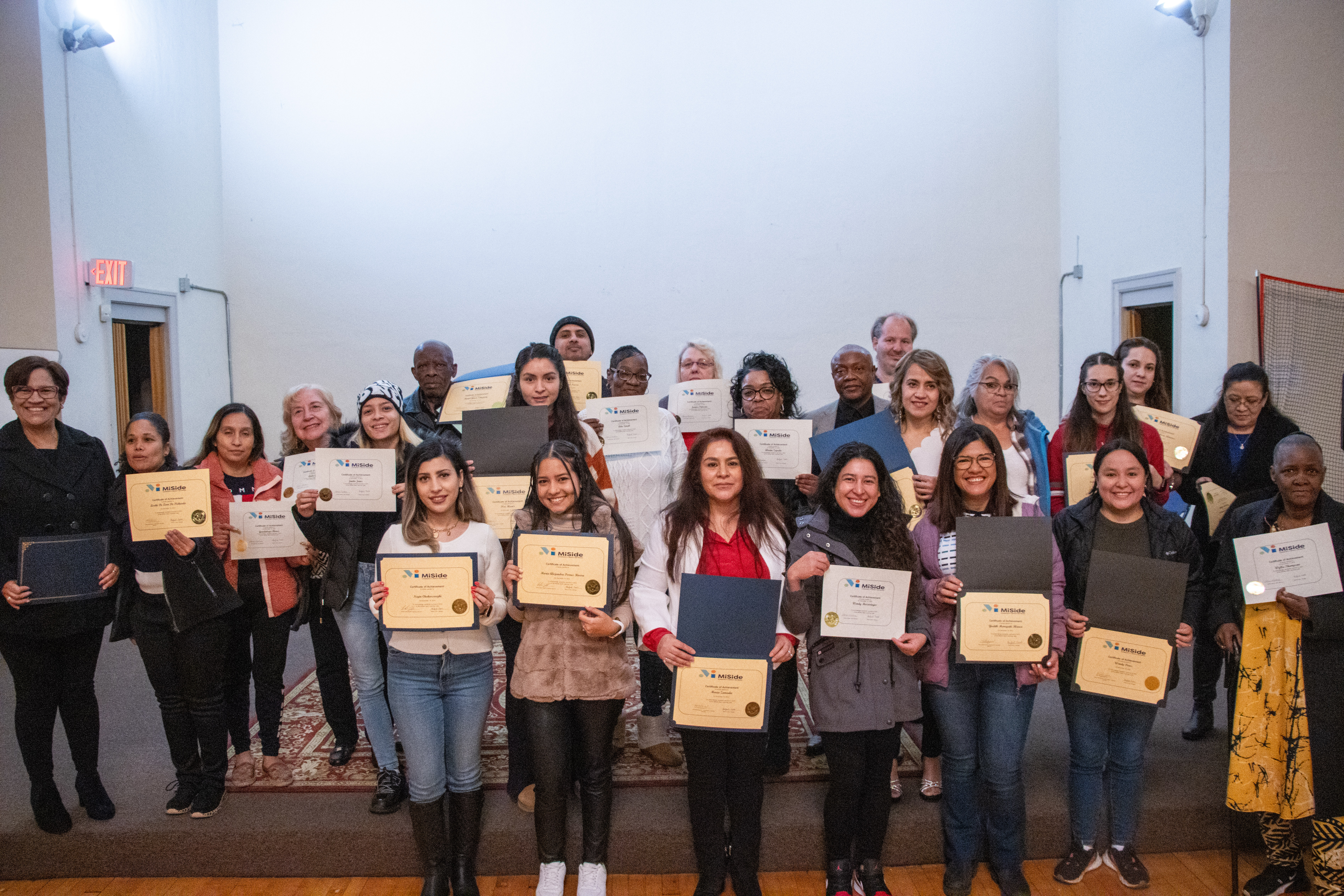 Adult students with certificates of achievement 