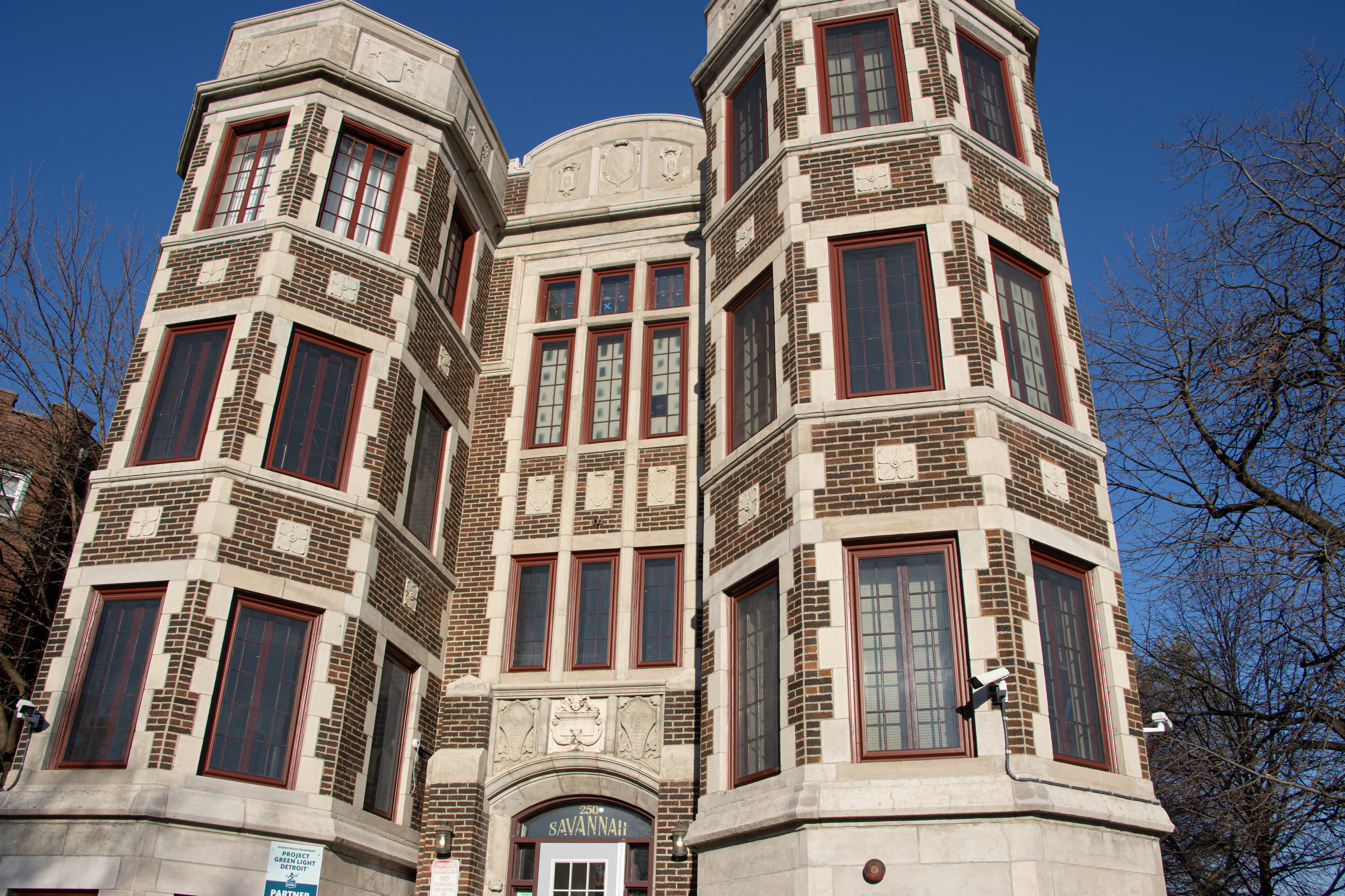 A beautiful older apartment complex with two towers
