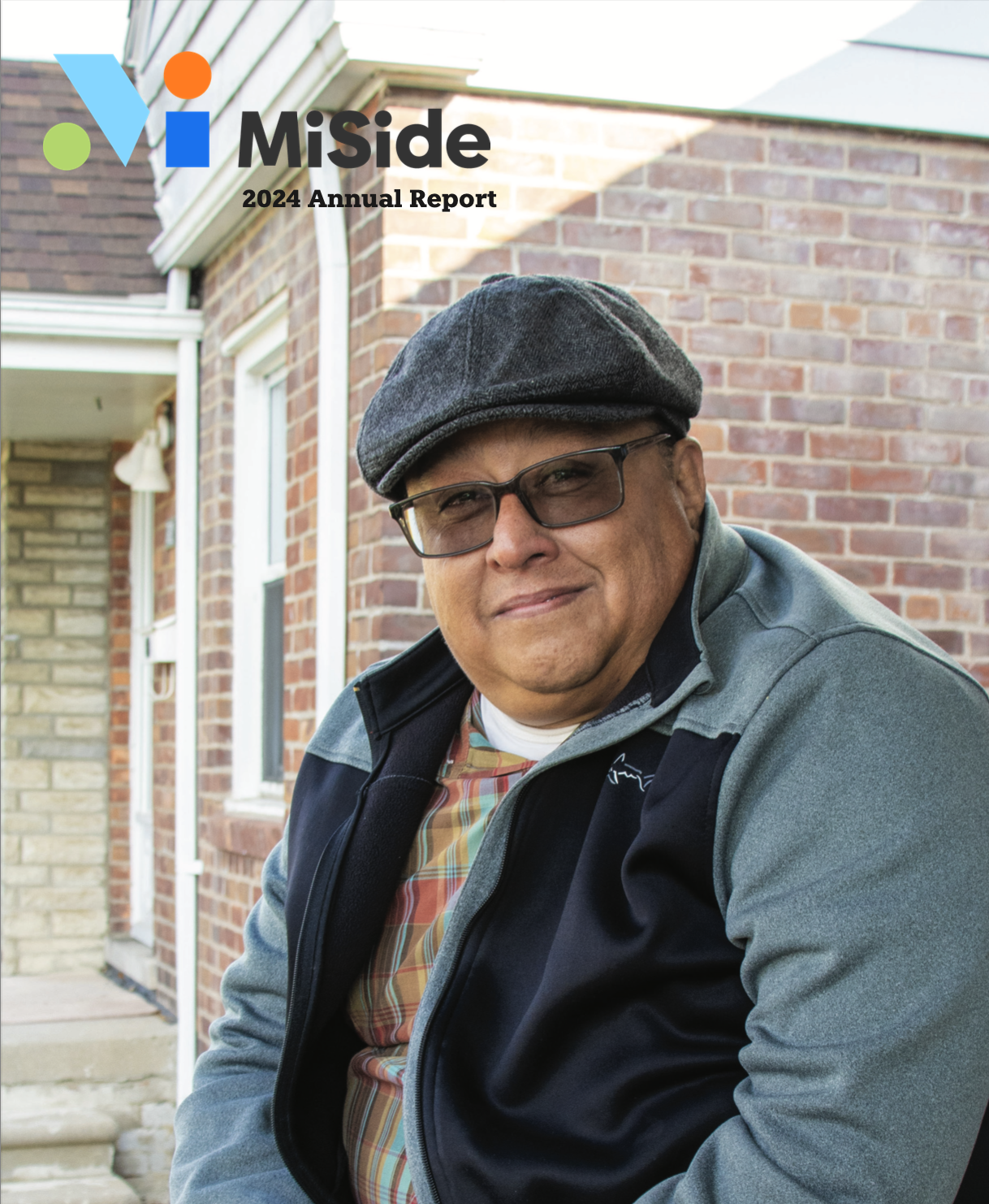 MiSide 2024 Annual Report cover features man sitting in front of brick home and smiling.