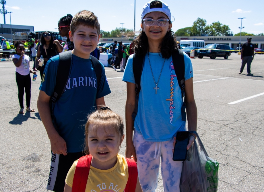 Three kids taking a photo