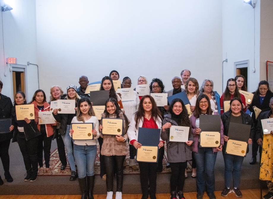 Adult students with certificates of achievement 