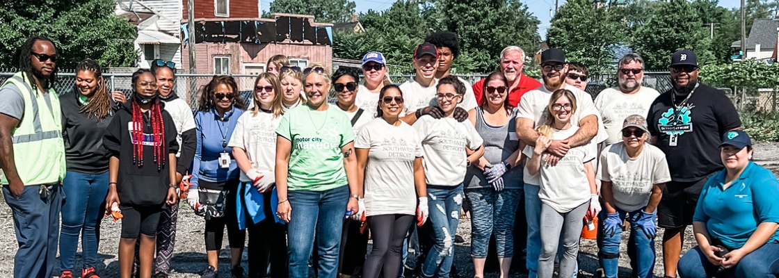 A group of volunteers stand together for a photo