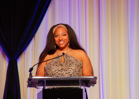 Takisa at the podium at Celebration of Impact 2022